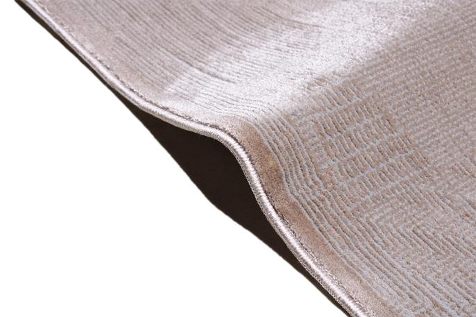 Infiniti Rug placed in a living room setting, adding warmth and elegance with its subtle beige tones.