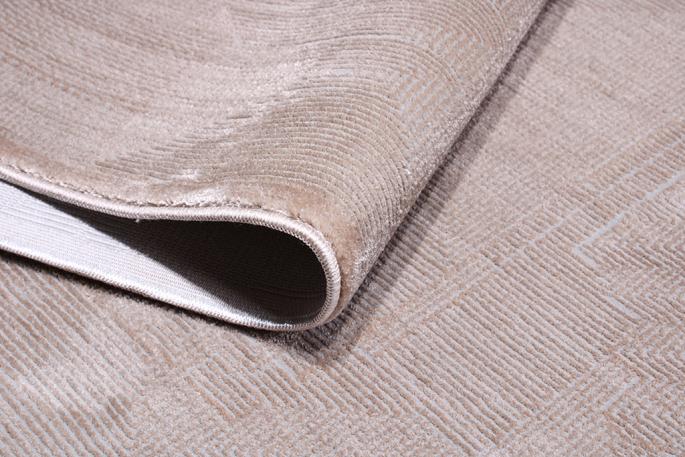 Angled view of Infiniti Rug under furniture, illustrating its seamless fit into diverse interior styles.