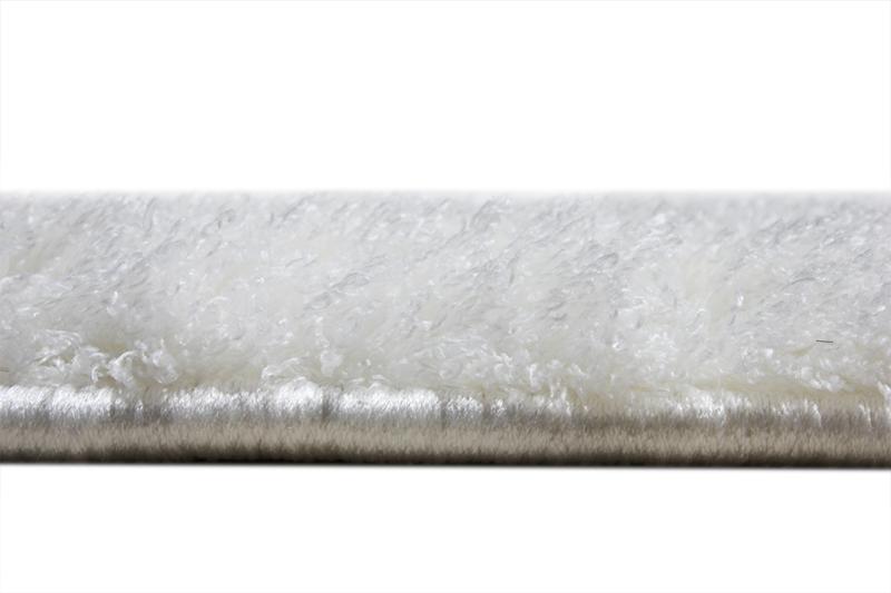 Angled view of Tampa Shaggy Rug under a coffee table, showcasing its seamless fit into cozy interiors.