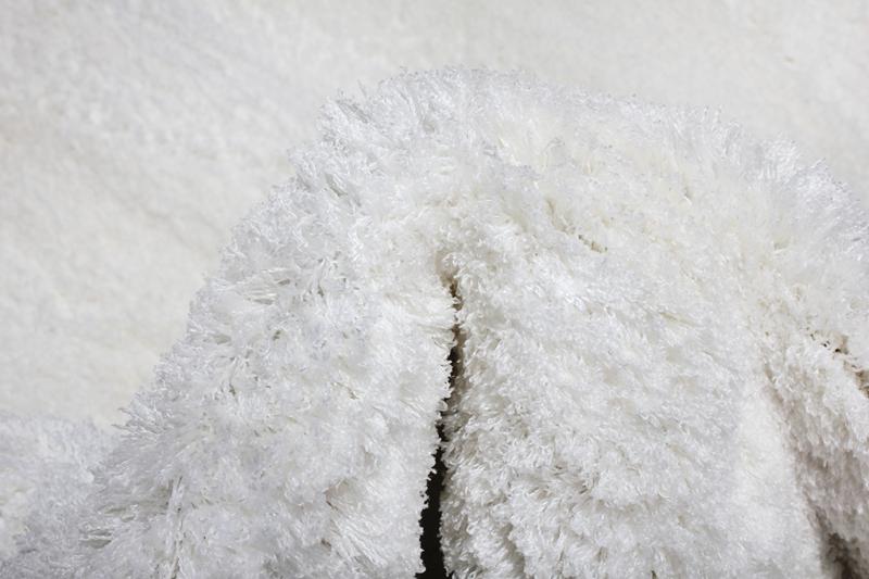 Tampa Shaggy Rug displayed in a comfortable living space, enhancing the area with its inviting white design.