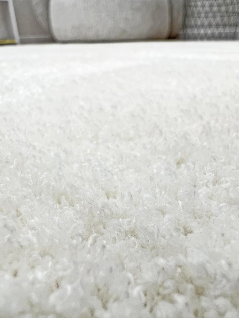 Tampa Shaggy Rug displayed in a comfortable living space, enhancing the area with its inviting white design.