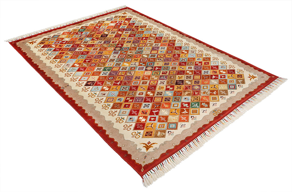 Overhead view colorful patterned area rug with fringe