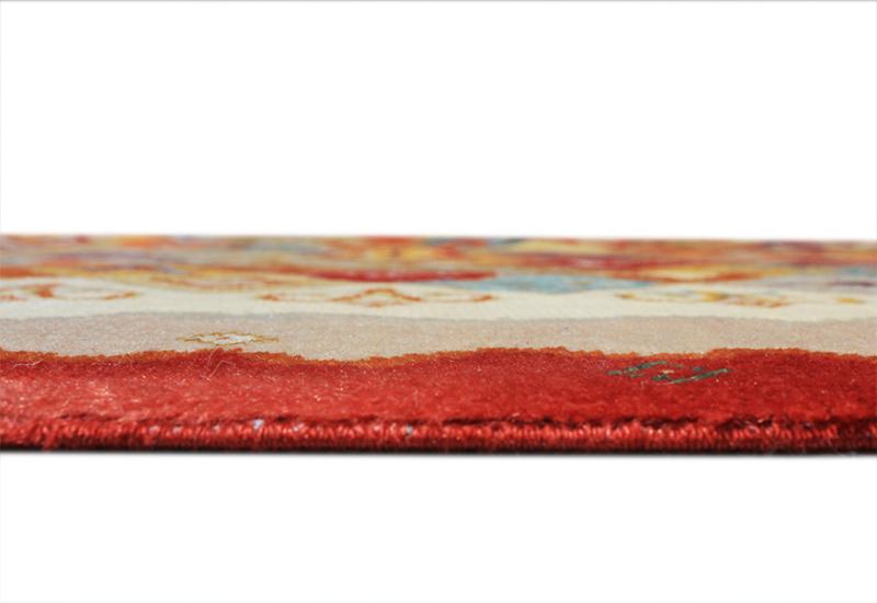 Close up of patterned rug edge with red border