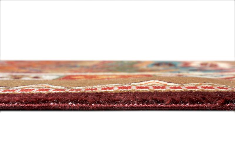 Close up view of colorful patterned rug edge showing thickness