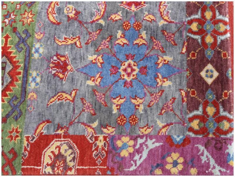 Close up view of colorful patterned area rug patchwork design