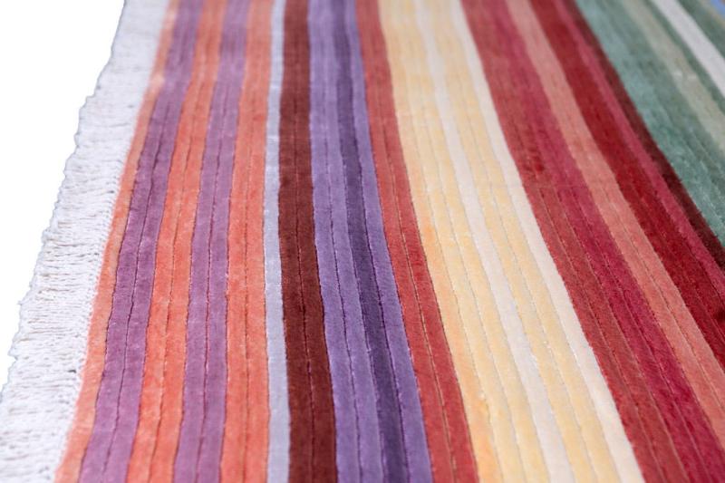 Vienna Rug placed in a stylish living area, adding a pop of color and vibrancy to the contemporary setting.