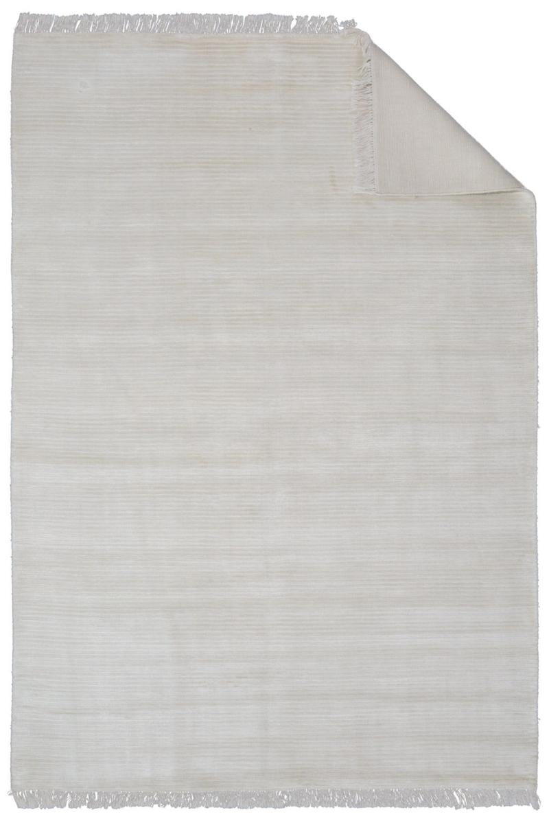 White rectangular area rug with horizontal stripe texture and fringe