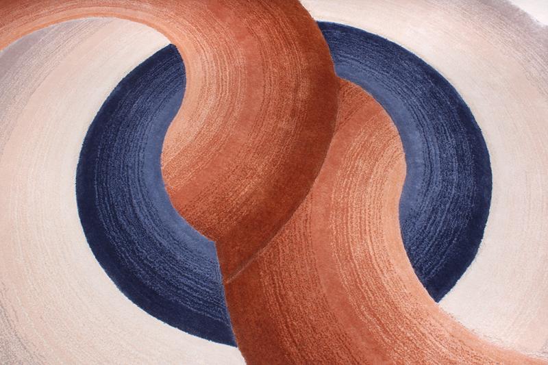 Close-up of the Circle Tufted Rug's artistic patterns, highlighting its distinctive style and quality.