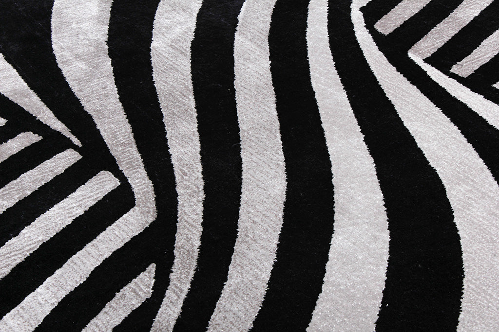 Black and white zebra stripe pattern rug close up