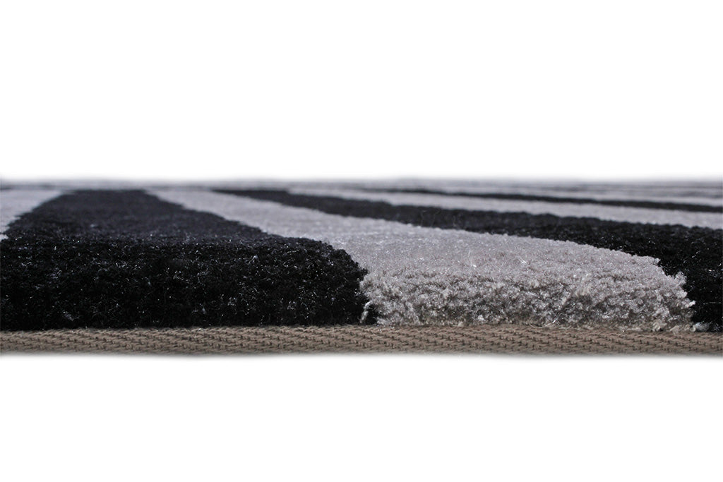Close up view of black and gray striped area rug edge