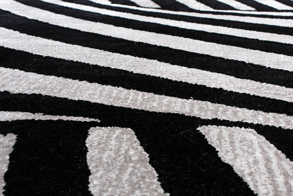 Close up of black and white striped area rug