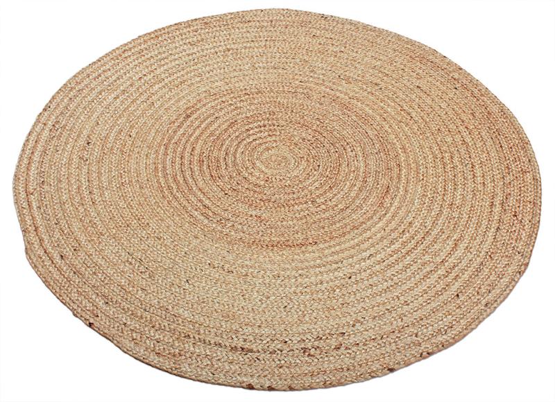 Round natural fiber braided area rug on white background