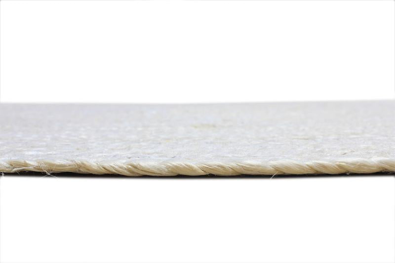 Side profile of round bleach rug showing subtle woven edging.