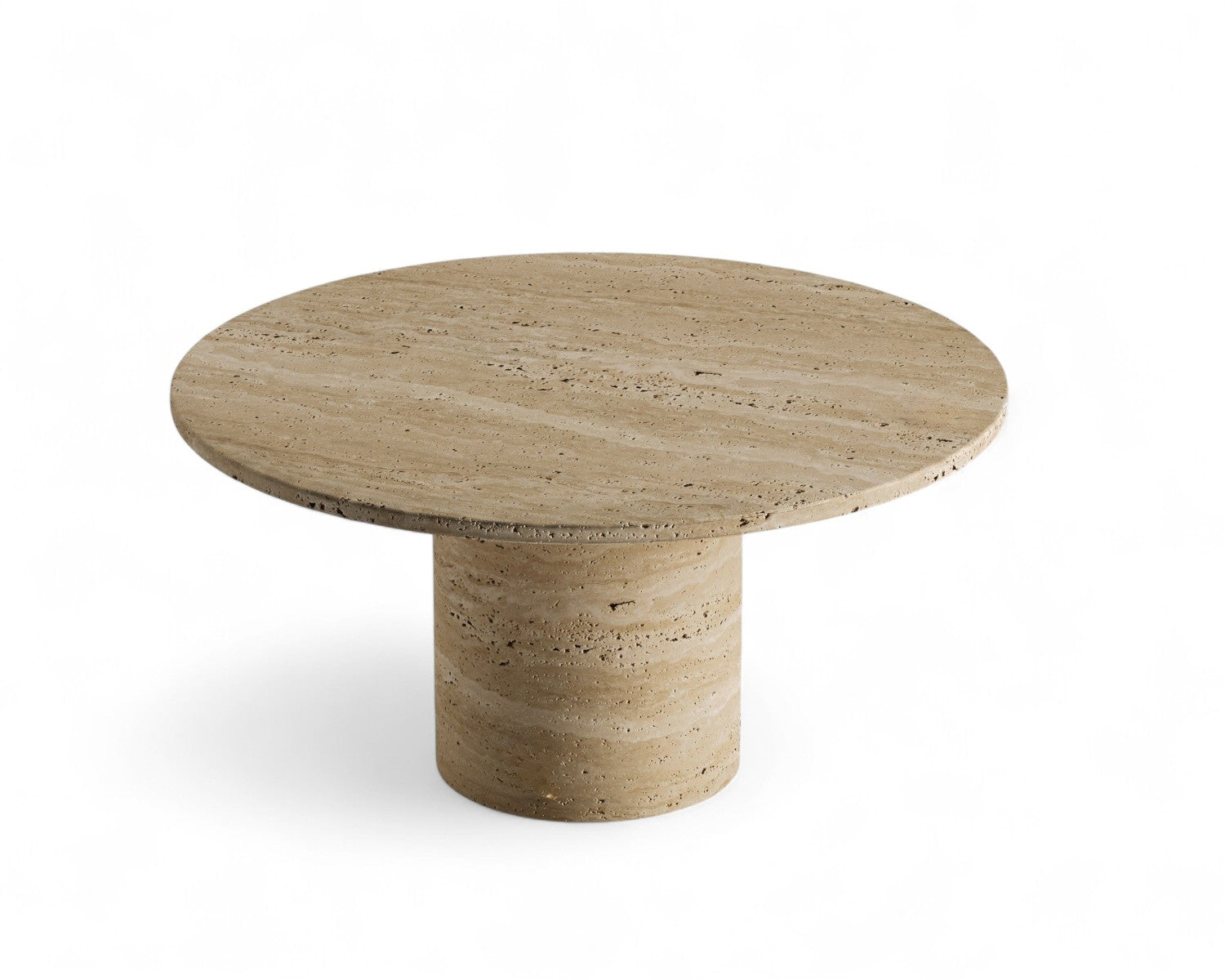 View of round travertine coffee table with cylindrical base, stone furniture, modern design.