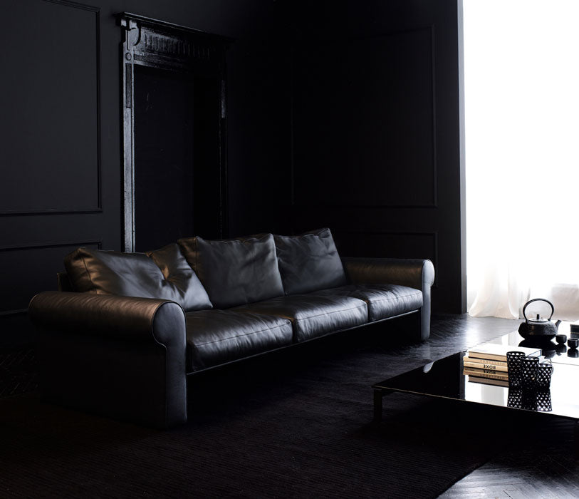 black leather sofa black glass coffee table black room decor