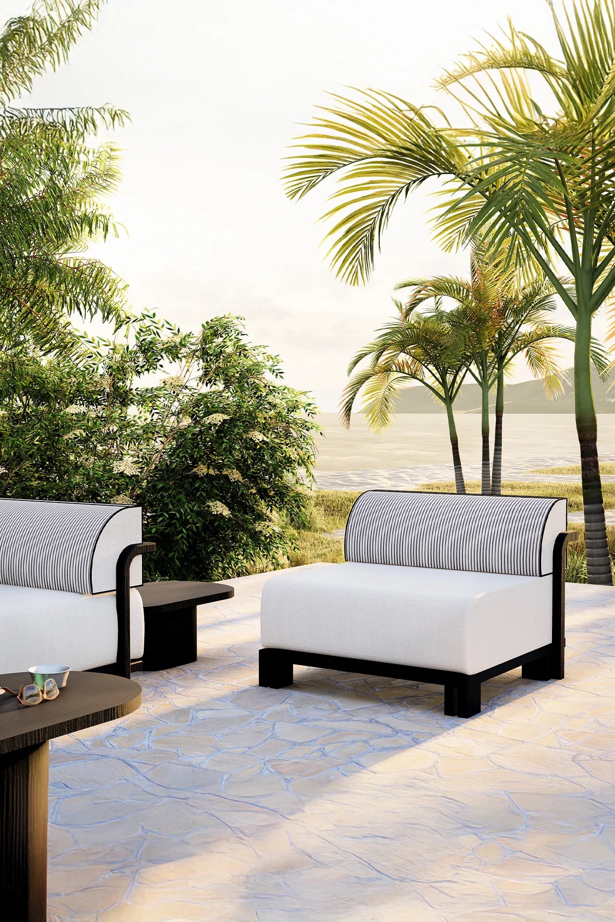 Iroko wood outdoor sofa and armchairs with modular design in a luxury garden setting.