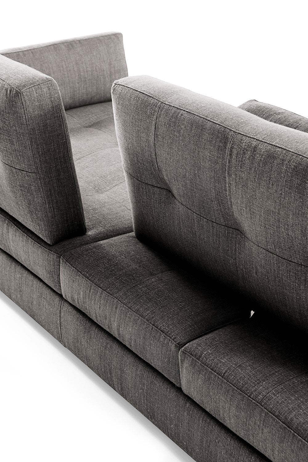 Close up view of gray fabric sofa back cushions