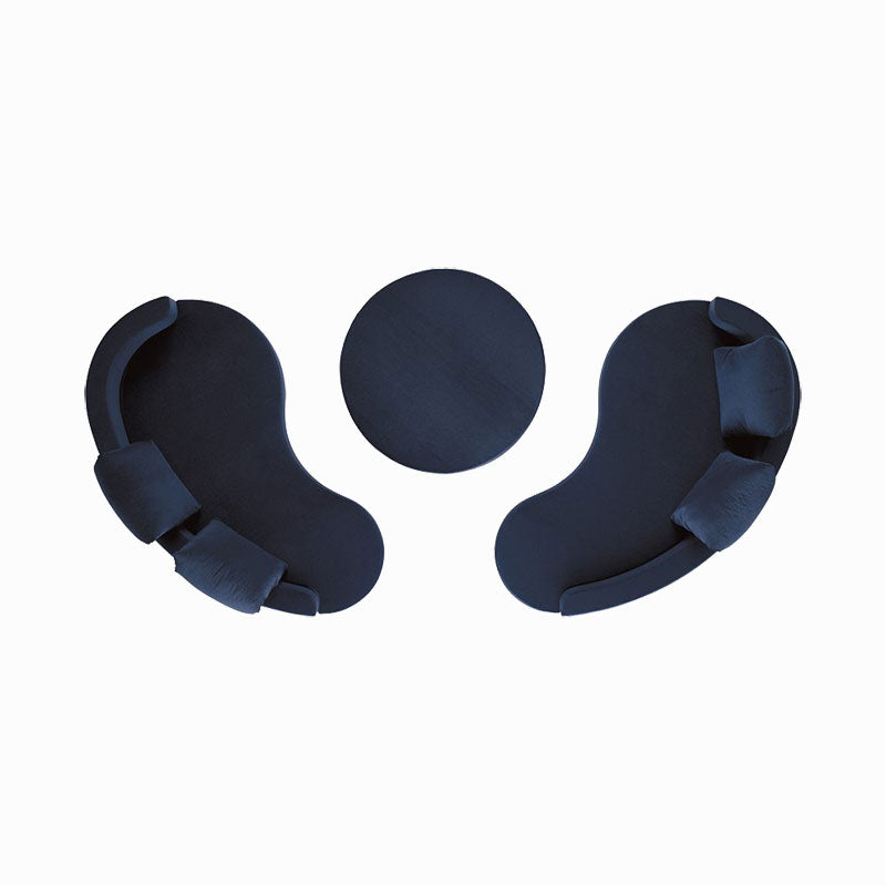 Overhead view of dark blue modular sofa sections and round ottoman