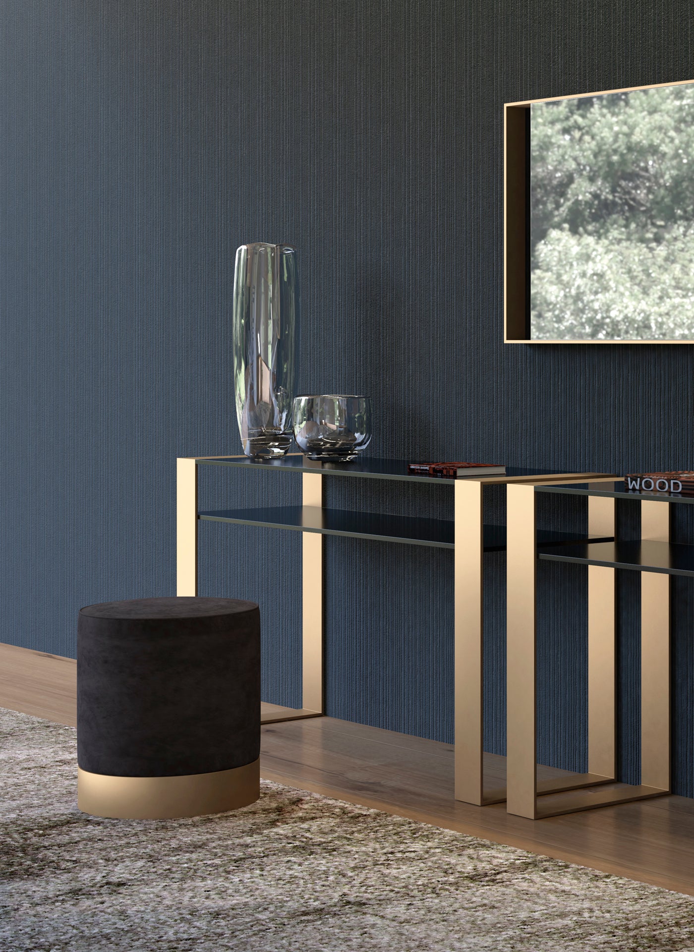 Interior view of gold metal and glass console table with black ottoman.