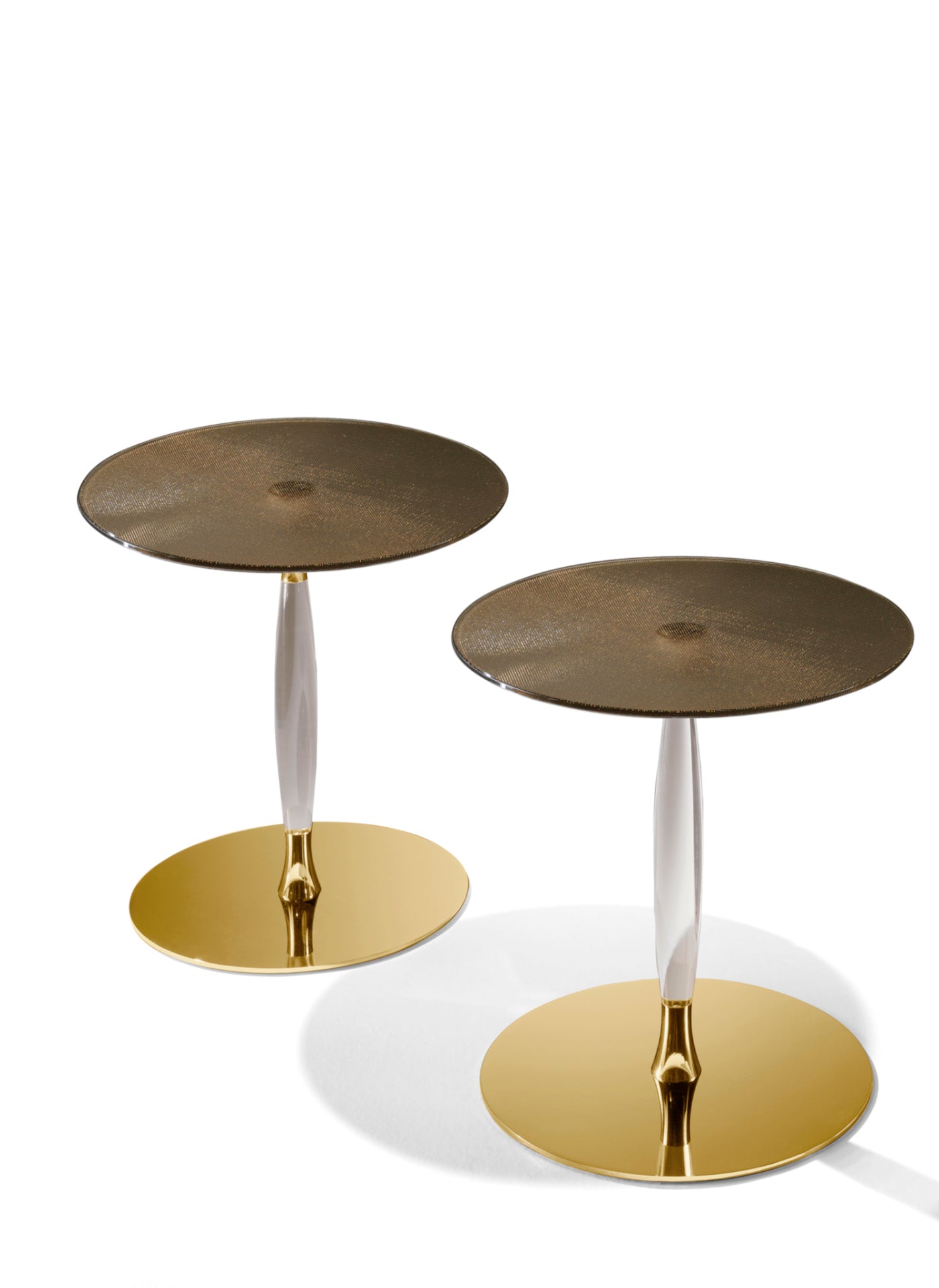 Pair of round tables with gold bases and textured tops