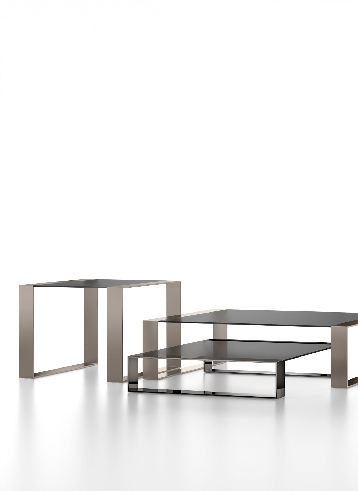 Studio shot of square metal and glass nesting tables