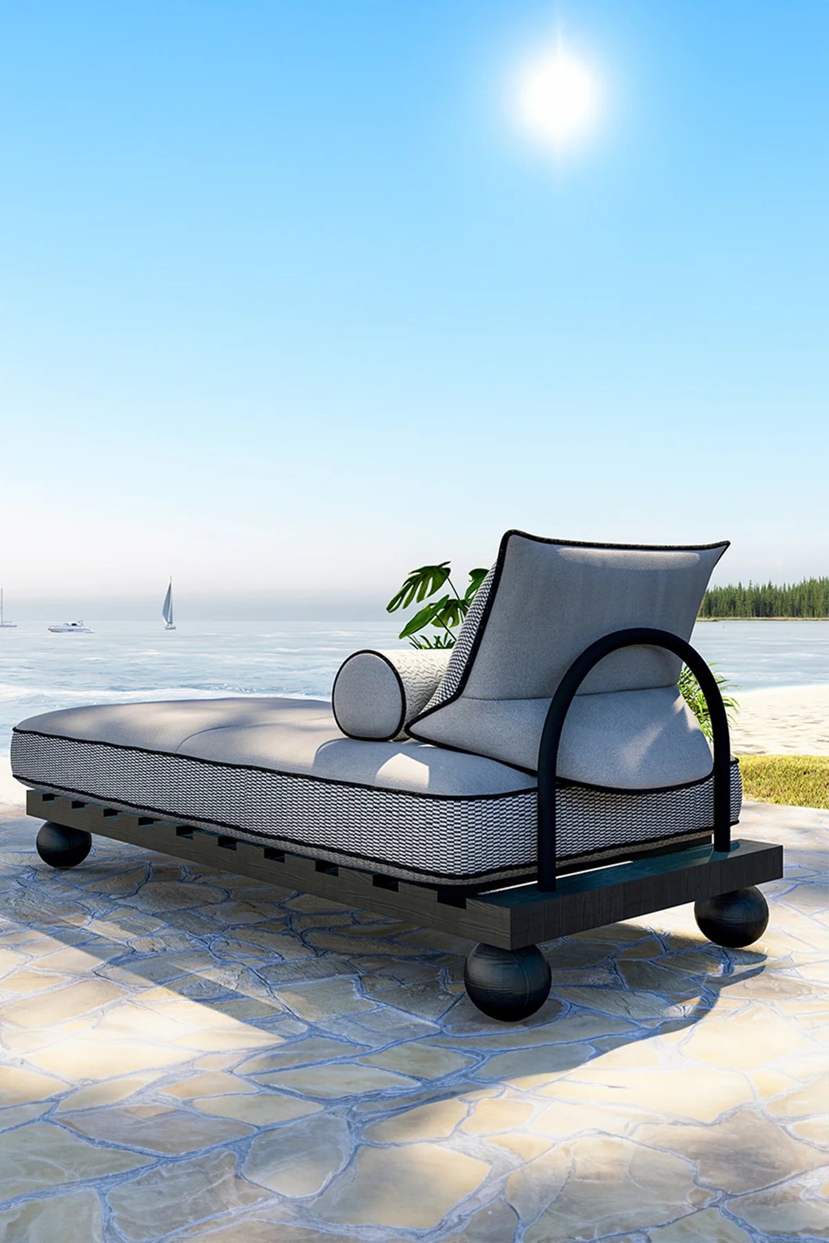 Outdoor lounge chair on a stone patio with a scenic background