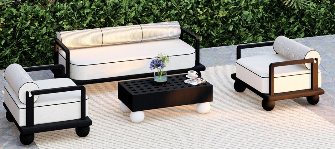 Outdoor furniture set with white cushions on a patio