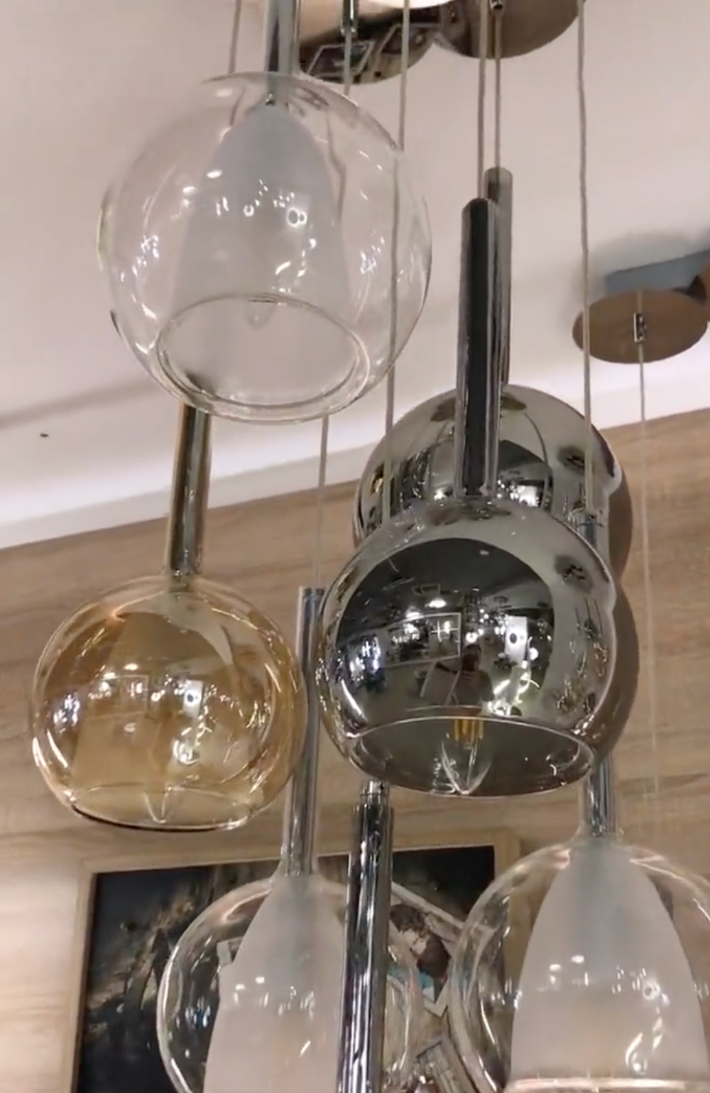 Close up view of multi-colored glass globe pendant lighting fixture