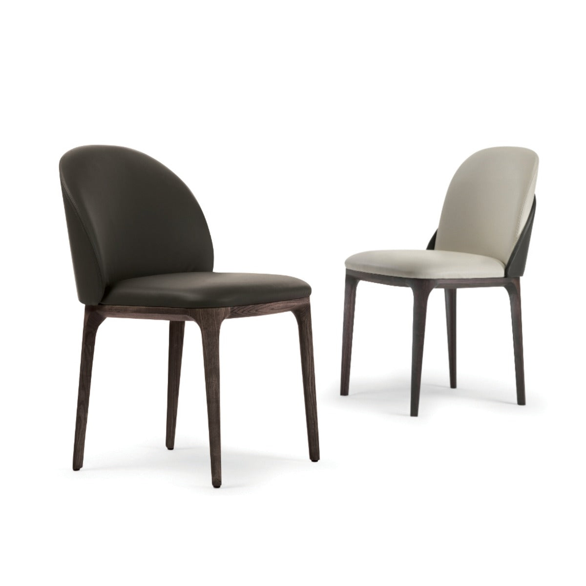 Pair of dining chairs with dark wood legs and leather upholstery