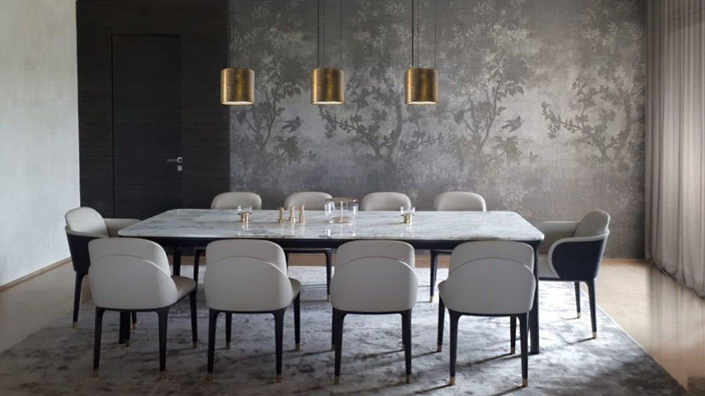 Dining room with marble table, chairs, rug, and pendant lighting
