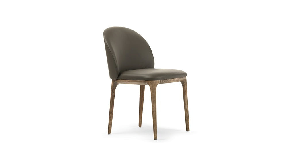 Studio shot of a gray leather dining chair with wooden legs.