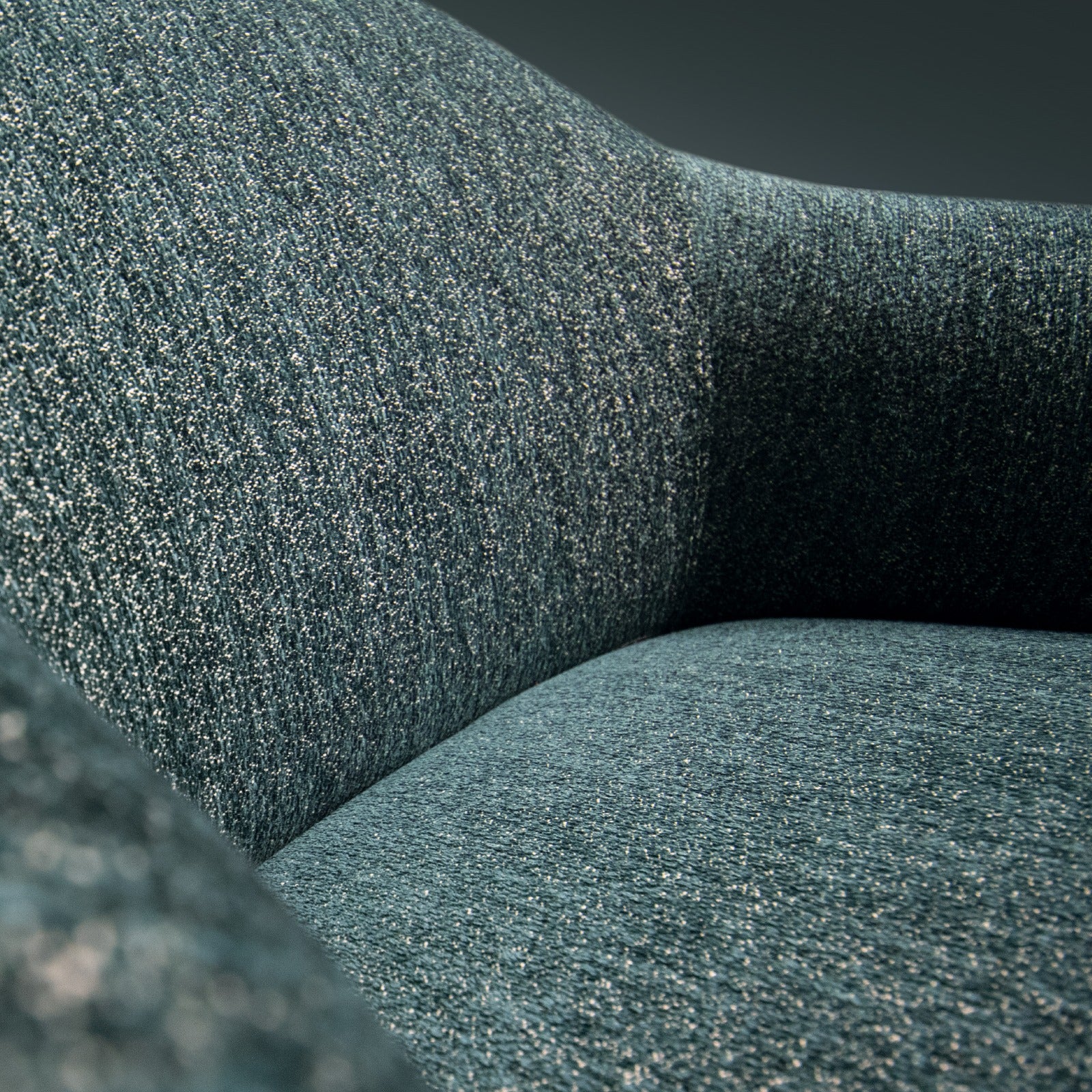 Close up of blue textured fabric upholstery on armchair