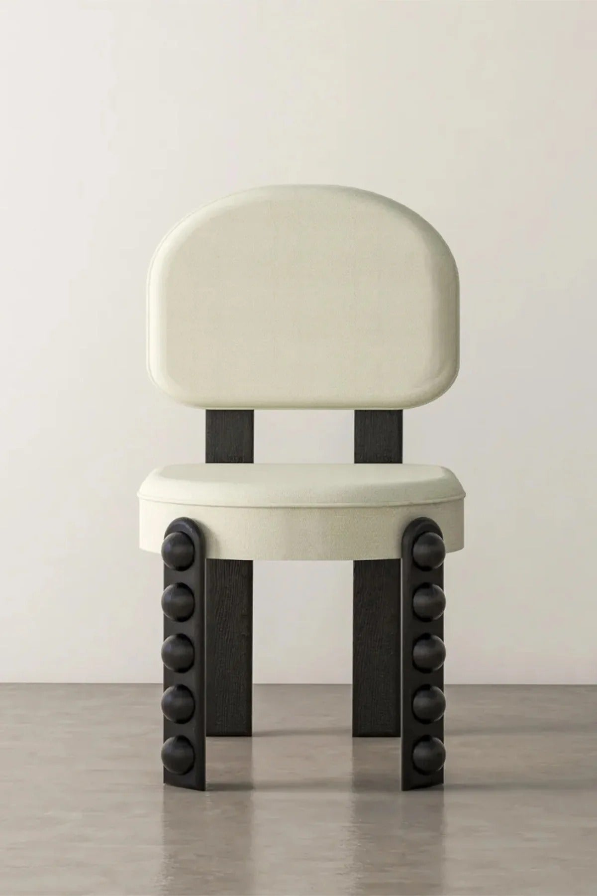 White upholstered chair with dark wood legs and black spheres furniture