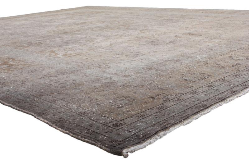 View of a large gray and brown patterned area rug.