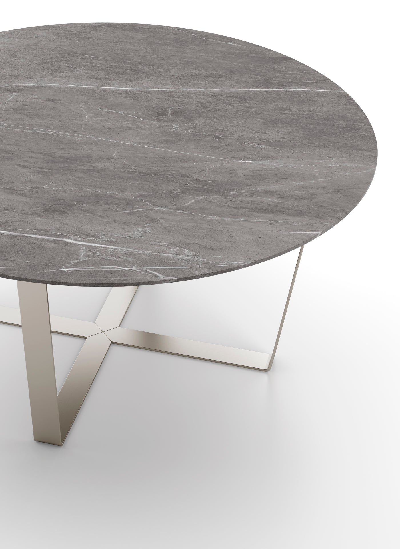 Close up view of round gray marble table with metal base.